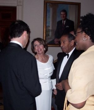 Rep. John Conyers and Speaker Nancy Pelosi, White House Holiday Party,  December 2002